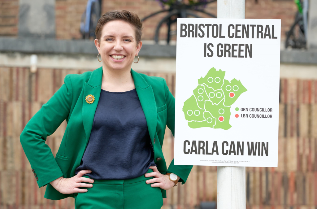 Carla Denyer with a sign showing Bristol Central is Green
