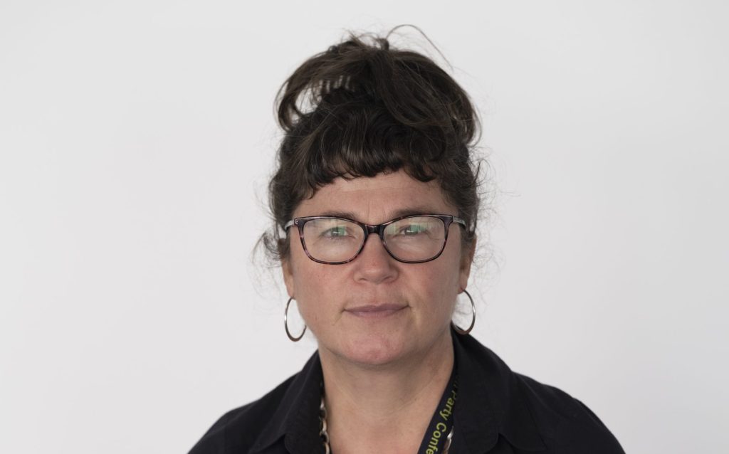 Councillor Cara Lavan Sat with hands together.
